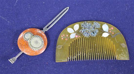 An early 20th century Japanese lacquered metal hair clip decorated with flowers, 11.5cm and a mother of pearl inset horn comb, 10cm